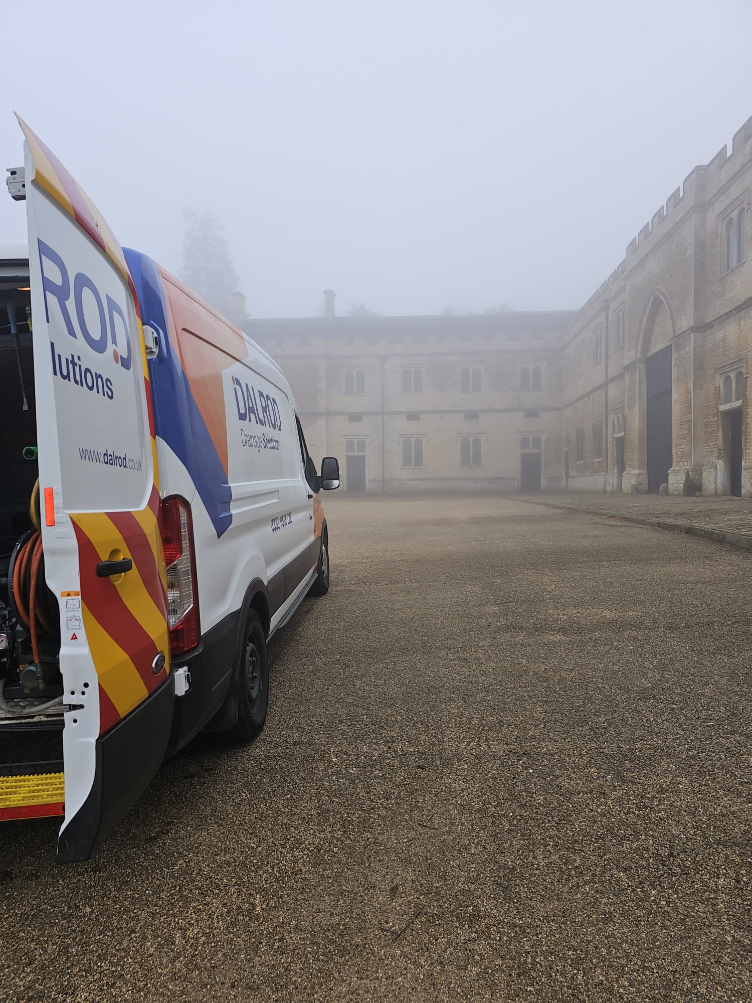 a DALROD van surrounded by mist at a stately home